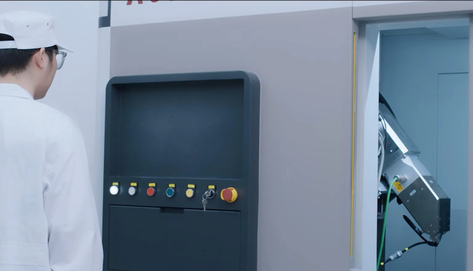 Royma engineer at the control panel of a CT system